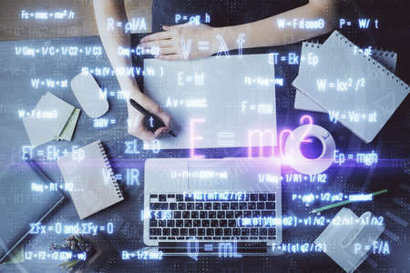 Science formula hologram over womans hands taking notes background. Concept of study. Double...