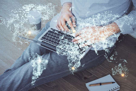 Media network theme hologram with man working on computer on background. Concept of internet communication. Double exposure.の写真素材