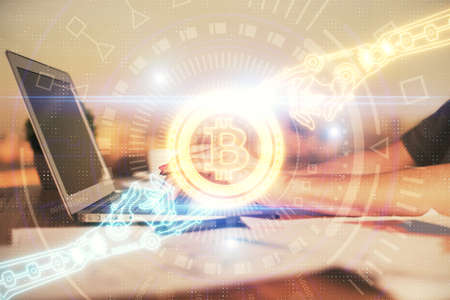 Double exposure of woman hands typing on computer and crypto market theme hologram drawing. Blockchain concept.の写真素材