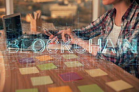 Double exposure of woman hands typing on computer and crypto market theme hologram drawing....
