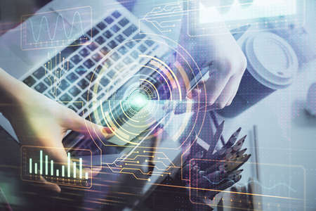 Multi exposure of woman hands working on computer and data theme hologram drawing. Tech concept.の写真素材