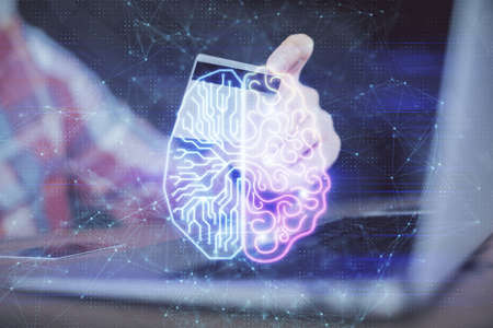 Double exposure of man hands typing on computer with credit card and brain theme drawing. E-commerce...