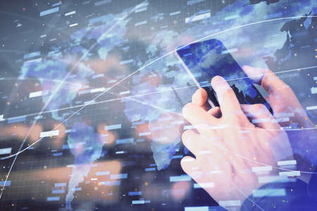 Double exposure of mans hand holding and using a digital device and data theme hologram drawing....