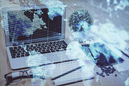 Double exposure of business theme icons and work space with computer background. Concept of success.