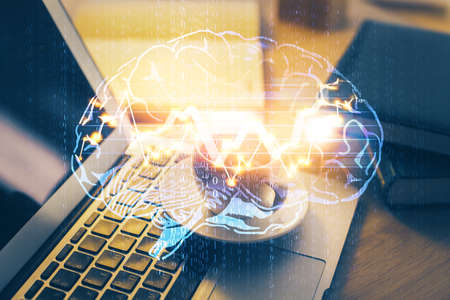 Double exposure of work space with computer and human brain drawing hologram. Brainstorm concept.