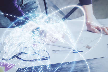 Double exposure of Man writing in notepad with business icons on background. Concept of...