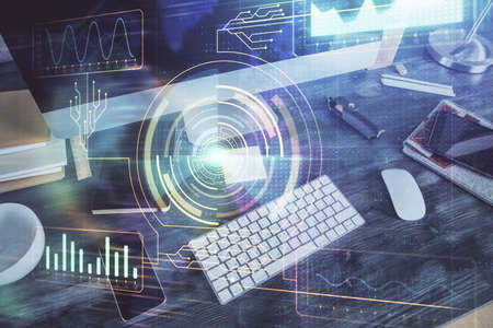 Technology theme drawing and table with computer. Double exposure. Concept of information.の写真素材