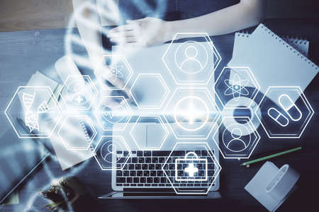 DNA theme hologram over womans hands writing background. Concept of education. Double exposure