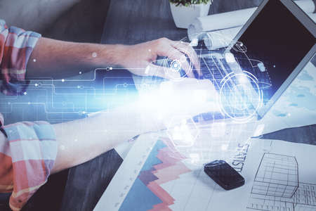 Media network theme hologram with man working on computer on background. Concept of internet...