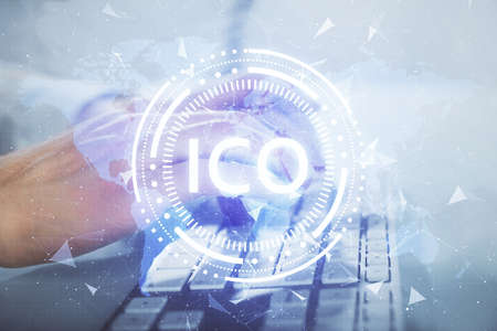 Crypto currency theme hologram with businessman working on computer on background. Concept of blockchain. Multi exposure.の写真素材