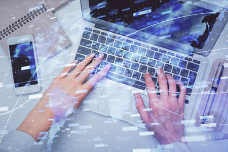 Double exposure of woman hands working on computer and data theme hologram drawing. Top View....
