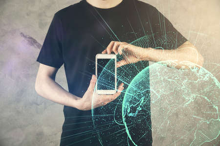Double exposure of mans hands holding and using a phone and social network theme drawing.の写真素材