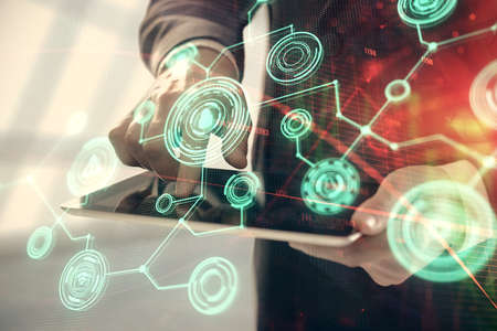 Double exposure of mans hands holding and using a phone and social network theme drawing.の写真素材