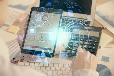 Double exposure of mans hands holding and using a phone and social network theme drawing.