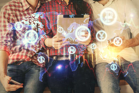 Double exposure of forex graph drawing and man and woman working together holding and using a mobile device. Trade concept.の写真素材