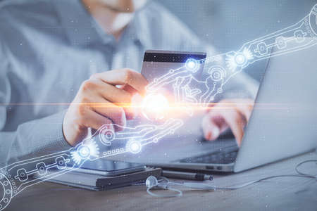 Double exposure of man hands holding a credit card and data theme drawing. E-commerce and technology concept.の写真素材