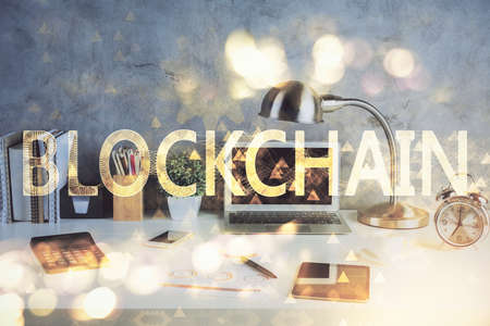 Double exposure of blockchain and crypto economy theme hologram and table with computer background. Concept of bitcoin cryptocurrency.の写真素材