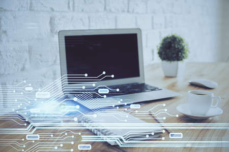 Double exposure of laptop computer and technology theme hologram. Concept of freelance work.の写真素材