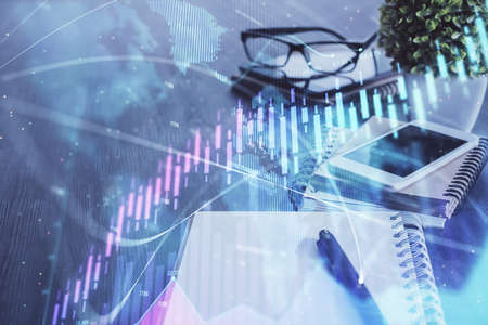 Double exposure of forex chart drawing and cell phone background. Concept of financial trading