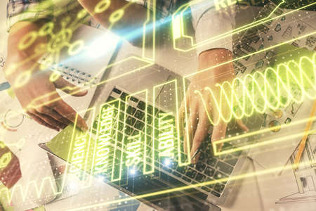 Double exposure of man and woman working together and education theme hologram drawing. Computer...