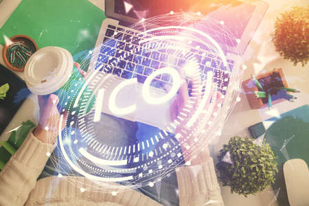Double exposure of woman hands working on computer and blockchain theme hologram drawing. Top View....