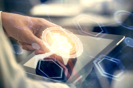 Double exposure of mans hands holding and using a phone and crypto currency blockchain theme drawing.の写真素材