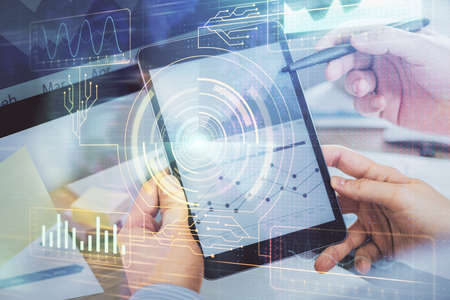 Multi exposure of mans hands holding and using a digital device and data theme drawing. Innovation concept.の写真素材