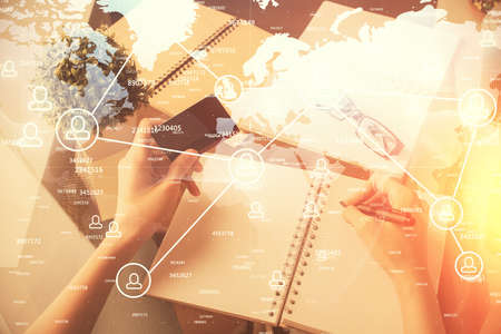 Multi exposure of woman on-line shopping holding a credit card and social network theme drawing. Relationship E-commerce concept.の写真素材