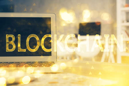 Multi exposure of blockchain theme hologram and table with computer background. Concept of bitcoin...