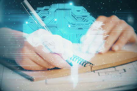 Multi exposure of writing hand on background with brain hologram. Concept of learning.