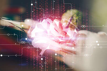 Multi exposure of writing hand on background with brain hologram. Concept of self learning.