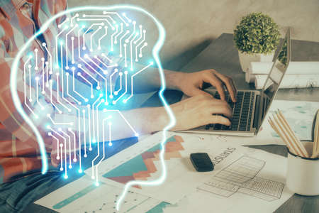 Man with computer background with brain theme hologram. Concept of brainstorm. Double exposure.