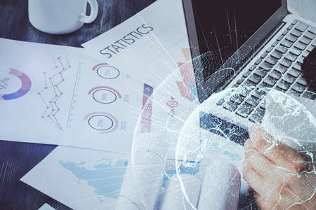 Media network theme hologram with man working on computer on background. Concept of internet communication. Double exposure.の写真素材