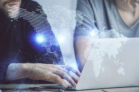 Media network theme hologram with man working on computer on background. Concept of internet...