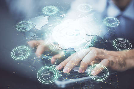 Media network theme hologram with man working on computer on background. Concept of internet communication. Double exposure.の写真素材