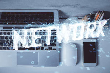 Multi exposure of data drawing hologram over topview of study desk background with computer. Concept of technology.の写真素材