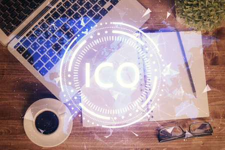 Blockchain theme hologram drawings over computer on the desktop background. Top view. Double exposure.の写真素材