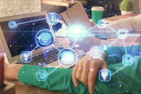 Double exposure of man and woman working together and social network theme hologram drawing. People...