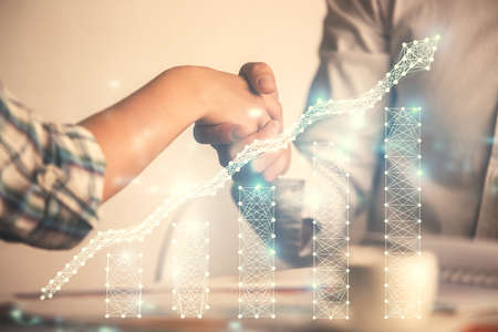 Double exposure of forex graph hologram and handshake of two men. Stock market concept.の写真素材