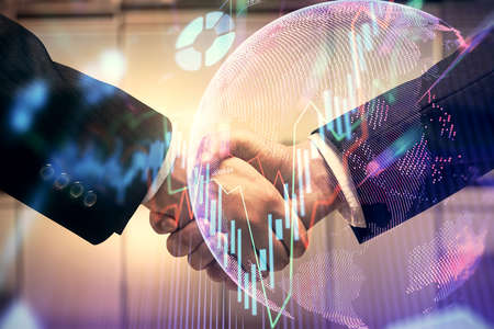 Double exposure of forex graph hologram and handshake of two men. Stock market concept.