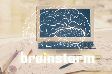 Desktop computer background in office and start up theme hologram drawing. Double exposure. Startup concept.の写真素材