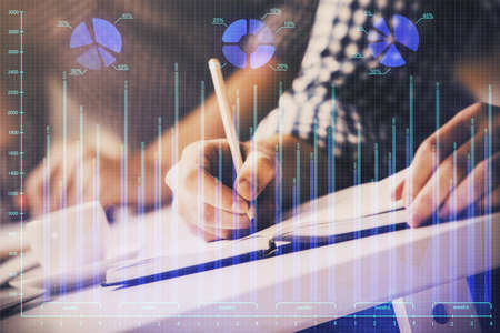 Multi exposure of two men planing investment with stock market forex chart background. Concept of...