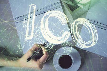 Cryptocurrency hologram over womans hands writing background. Concept of blockchain. Double exposure