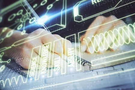 Education theme hologram over womans hands writing background. Concept of study. Double exposure
