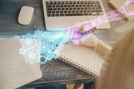 Multi exposure of writing hands on background with data solution hologram. Technology concept.