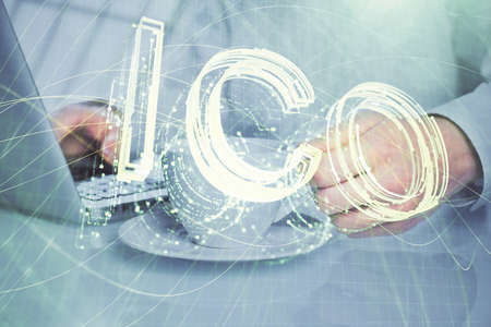 Blockchain theme hud with businessman working on computer on background. Concept of crypto chain. Multi exposure.の写真素材