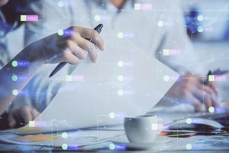 Double exposure of data theme sketch drawing over people writing background. Concept of technology