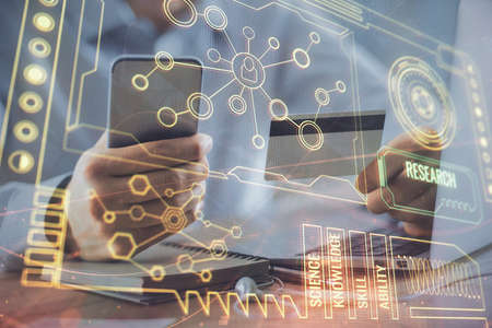 Double exposure of man hands holding a credit card and data theme drawing. E-commerce and technology...