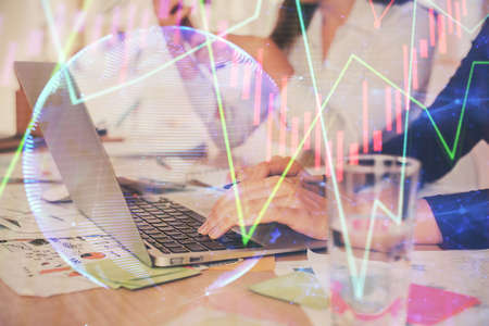 Multi exposure of woman hands typing on computer and forex chart hologram drawing. Stock market...