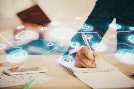 Double exposure of social network theme drawing over people taking notes background. Concept of human connectionの写真素材